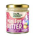 A jar of Limited Edition Mini Egg Butter with a vanilla base and crushed chocolate eggs, featuring a festive Easter label.
