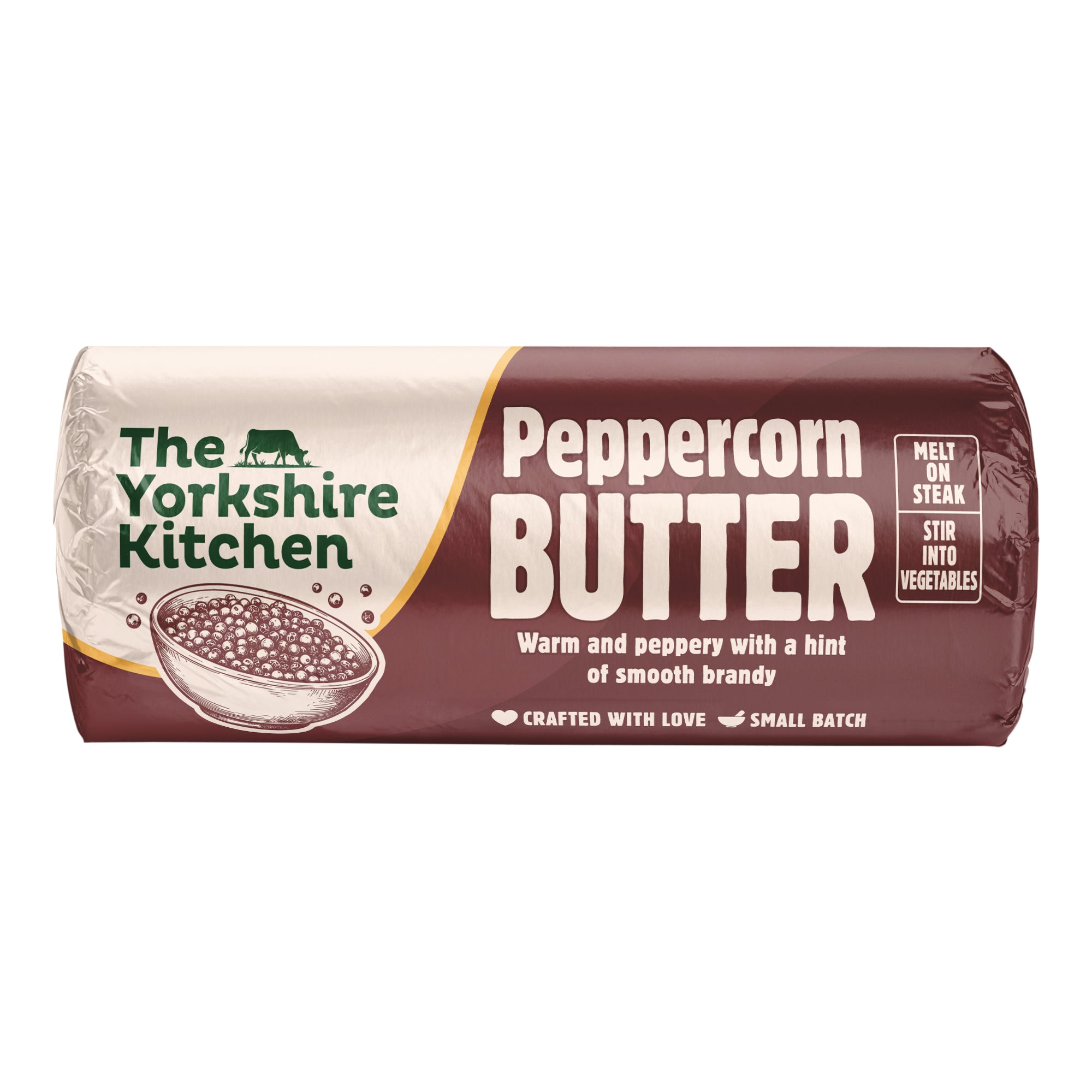 Wrapped roll of The Yorkshire Kitchen Peppercorn Butter in deep brown and cream packaging, featuring an illustration of a bowl of peppercorns. Large white text reads ‘Peppercorn Butter’ with the description ‘Warm and peppery with a hint of smooth brandy.’ The wrapper suggests ‘Melt on steak’ and ‘Stir into vegetables,’ and includes ‘Crafted with love’ and ‘Small batch’ text.